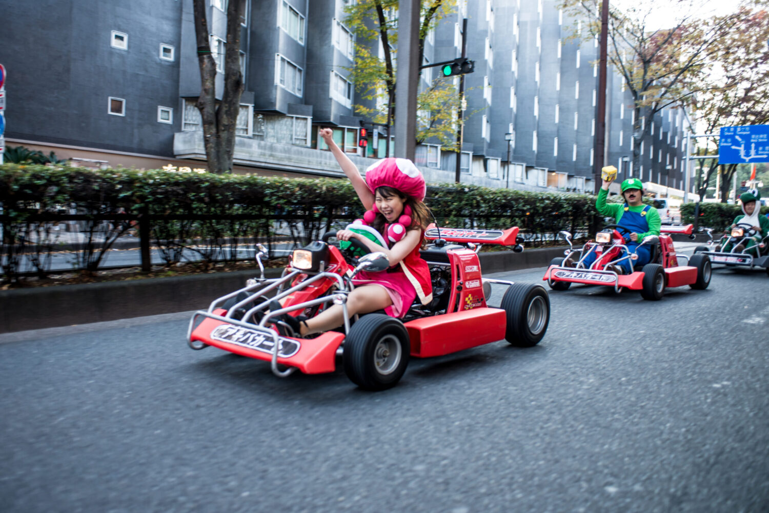 TOKYO, JAPAN - NOVEMBER 16:  Participants drive around Tokyo for the Real Mario Kart event in Tokyo...